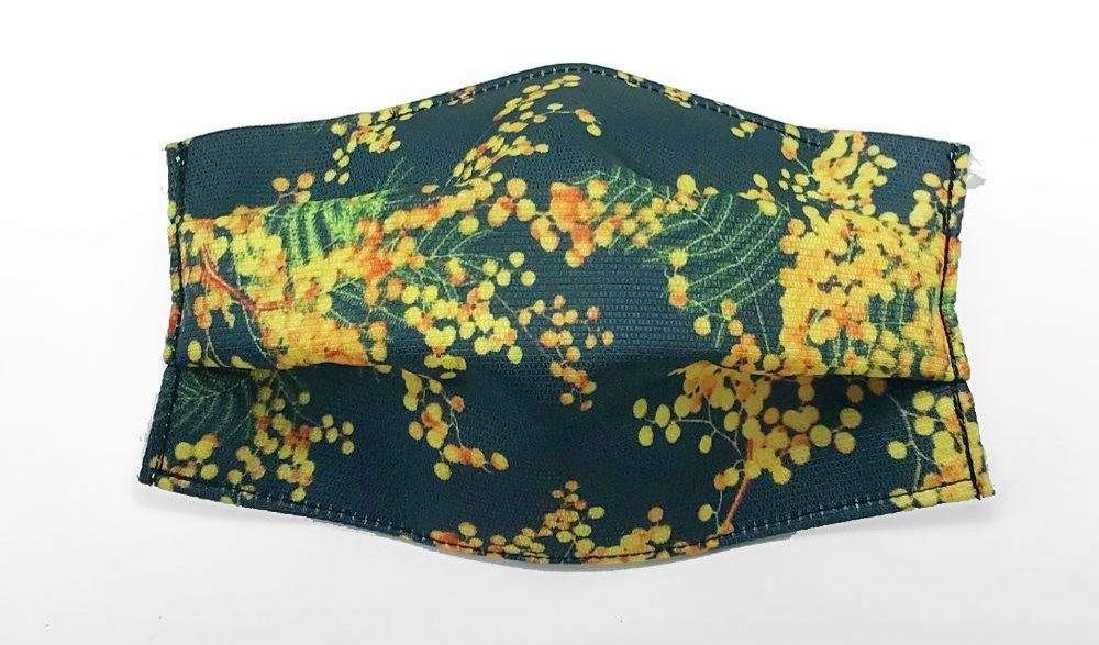 色のベースに気分が明るくなりそうな黄色のミモザ柄